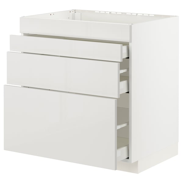 Modern white kitchen cabinet with four pull-out drawers.