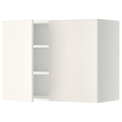 White wall-mounted kitchen cabinet with one open door, revealing two shelves.