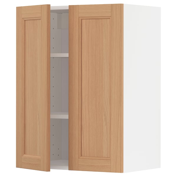 A light brown wooden kitchen cabinet with one door open, revealing an adjustable shelf inside.