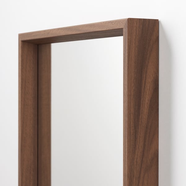 Walnut-finished wooden frame, rectangular mirror edge, smooth texture, sturdy construction.