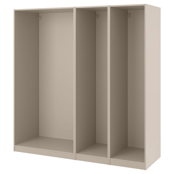 A beige ikea PAX wardrobe frame. Its rectangular, open-fronted, and made from particle and fiberboard with a semi-matte finish.