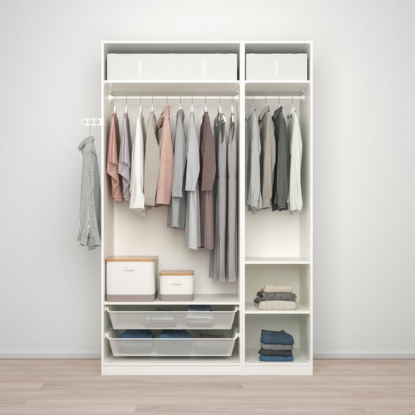 Ordered wardrobe with clothes, shelves, and storage boxes.