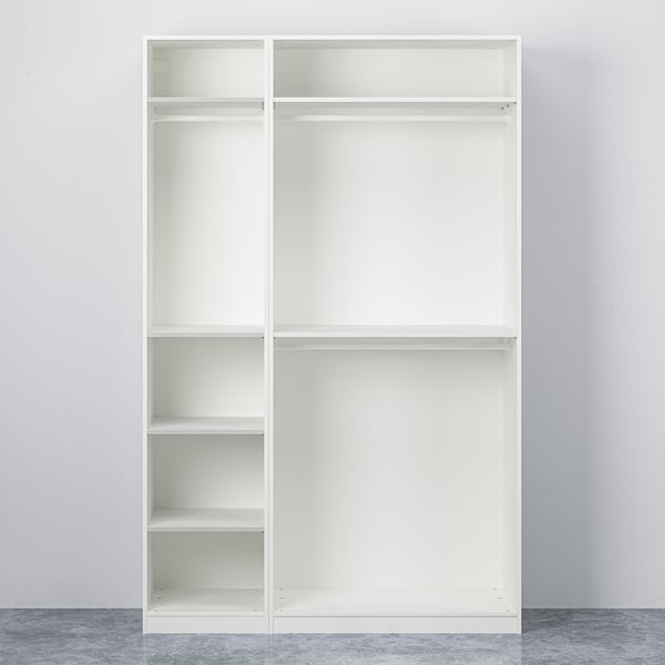 Empty, white, freestanding PAX wardrobe with multiple shelves, adjustable feet, and no doors.