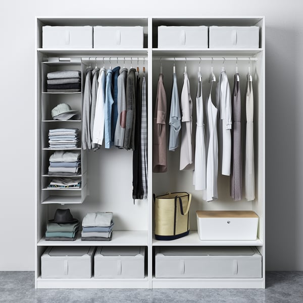 PAX wardrobe with organised shelves, clothes, and storage bins.