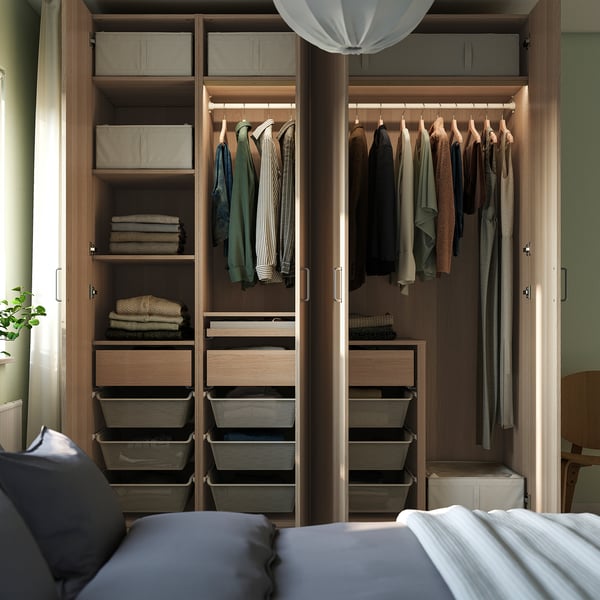 Organised wardrobe displaying clothes, baskets, and shelves, showing efficient storage for various items.