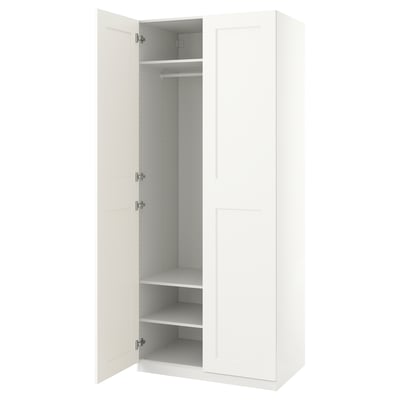 White PAX wardrobe; slim, modern; open doors reveal inner shelves & rail; neat design.