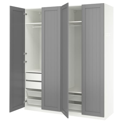 Grey PAX wardrobe, open showing drawers, shelves, and rail.