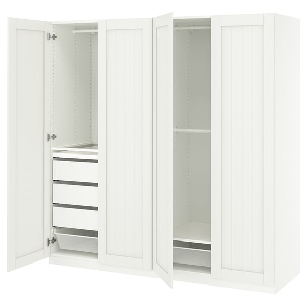 White ikea PAX wardrobe with open doors, shelves, and drawers.