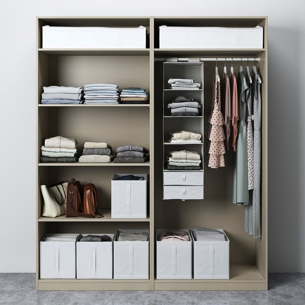 Organised wardrobe with shelves, folded clothes, hanging garments, and storage bins. Wardrobe includes sliding doors and adjustable interiors.