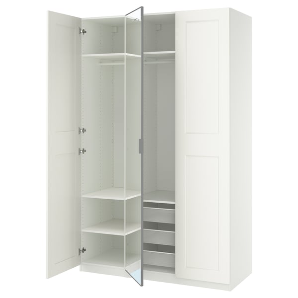 White PAX wardrobe, open doors showing shelves and drawers, modern minimalist design.