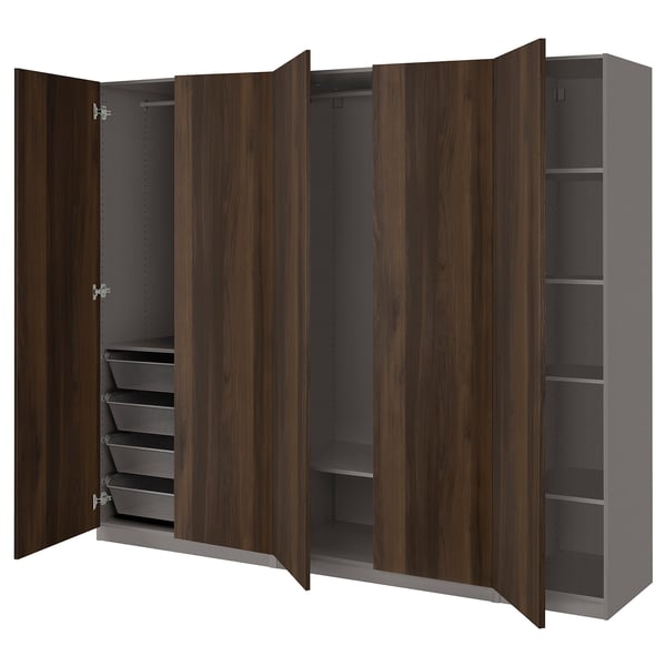 An open wooden wardrobe, the PAX. It has shelves, drawers, and hanging space.