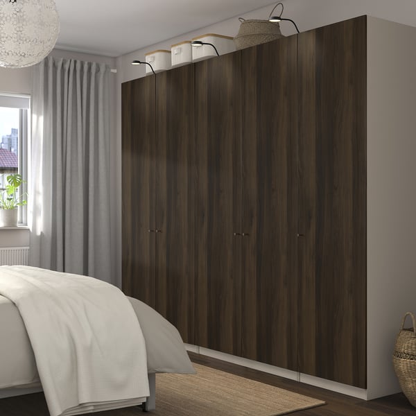 Wardrobe, bed, window with curtains. Rug & basket nearby. Dark wardrobe option.