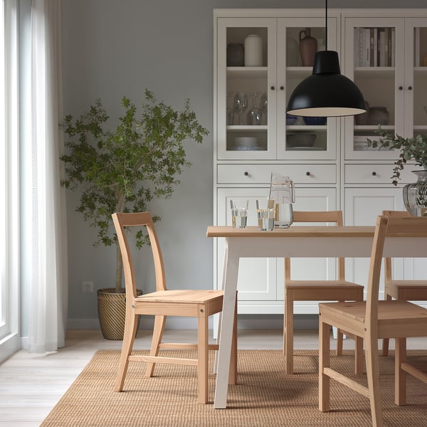 Modern dining: PINNTORP wooden chair near cabinet and table.