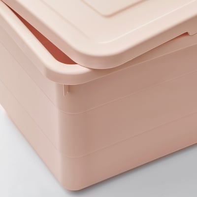 Stack of pink plastic storage boxes with lid, showing durable, smooth finish and locking mechanism.