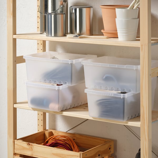 Wooden shelves with clear plastic storage boxes and metal containers, with white and terracotta pots.