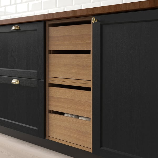 Modern kitchen unit with two pull-out drawers, showing smooth, organised storage solution.
