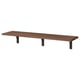 A BERGSHULT wall shelf in dark brown, supported by three black brackets. It has a bevelled and smooth edge design.
