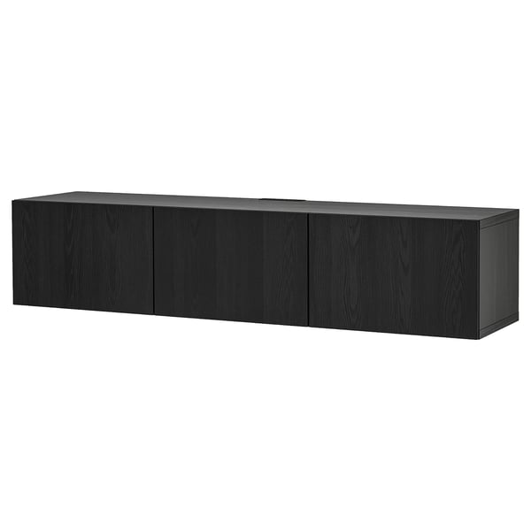 A black BESTÅ tv bench with four doors, providing ample storage. The modern design clean lines and a sleek finish, perfect for contemporary spaces.