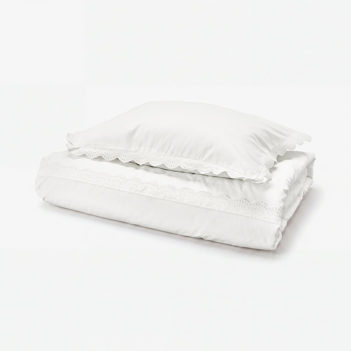White cotton duvet set with lace trim, folded neatly.