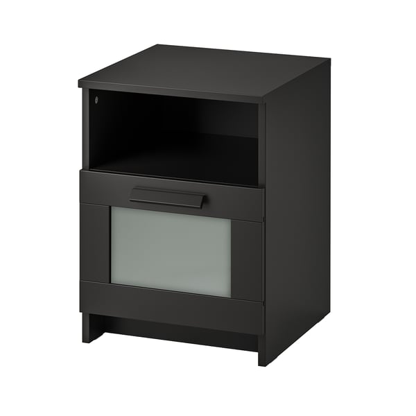 A black BRIMNES bedside table with a top shelf, drawer, and tempered glass front.