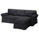 An EKTORP grey fabric sectional sofa with a chaise lounge. It has a modern design with thick cushions and a reversible backrest.