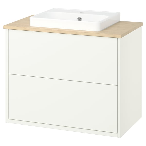 A HAVBÄCK white bathroom vanity with a bamboo countertop and a square ceramic sink. It has a modern minimalist design.