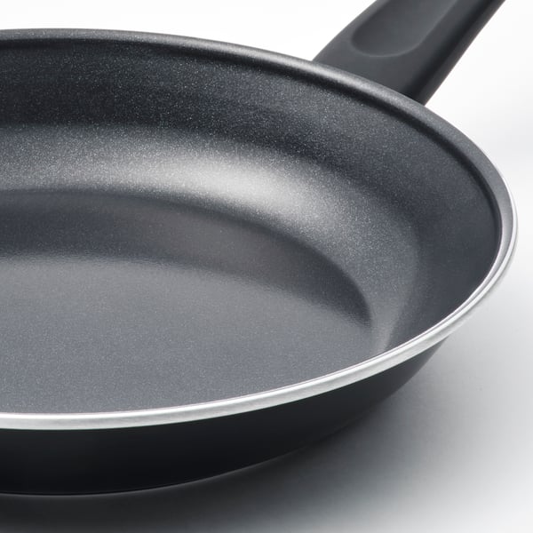 A high-quality non-stick frying pan with a sleek, dark interior and a sturdy black handle, designed for even heat distribution.