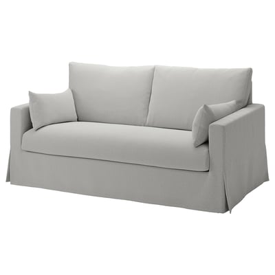 A HYLTARP light gray fabric convertible sofa with a soft, modern design, ideal for relaxation and easy transformation into a bed.