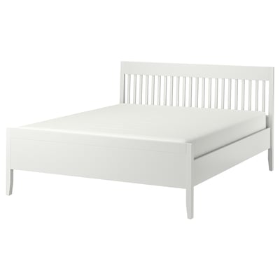 White IDANÄS bed, minimalist design, wooden frame with slatted headboard.