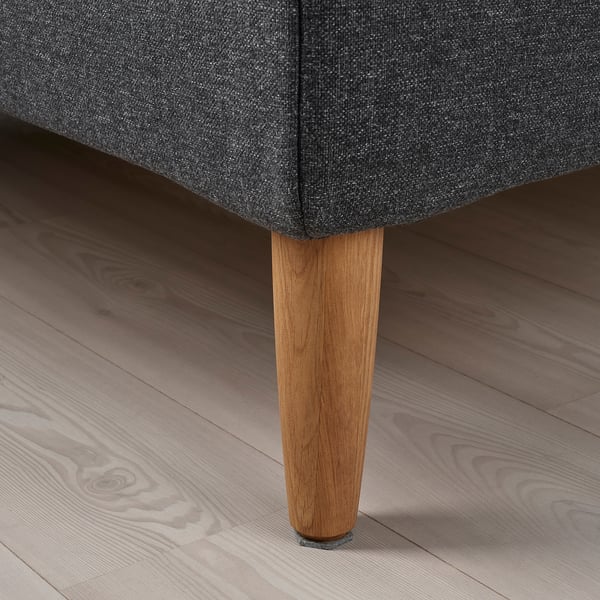 Dark grey upholstered bed with sleek wooden legs, showcasing high-quality fabric and sturdy craftsmanship.