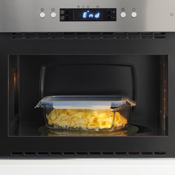 Microwaved food in IKEA 365+ glass container with lid.