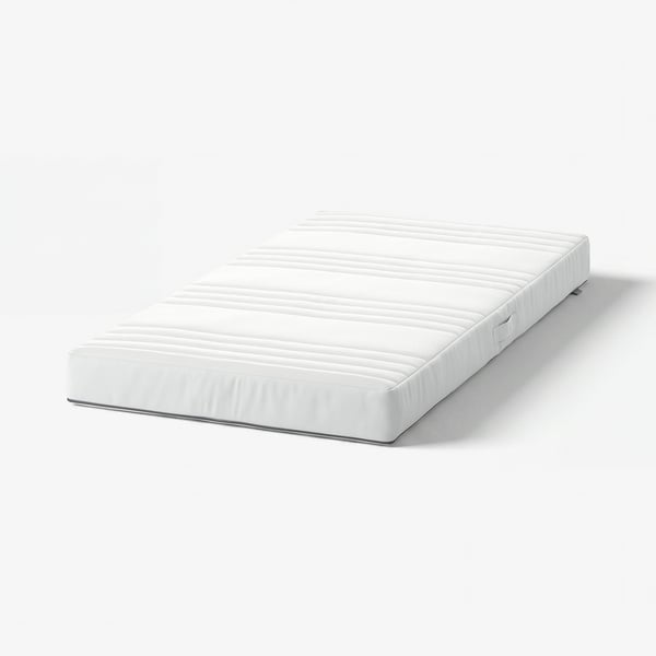 White baby mattress with textured surface and zip.