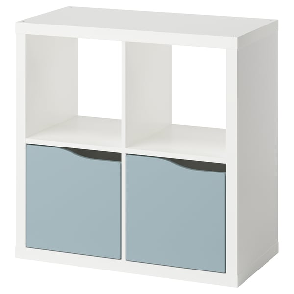 A white KALLAX shelf unit with two blue drawers. It a modern design with a square shape. The drawers have reflective doors.