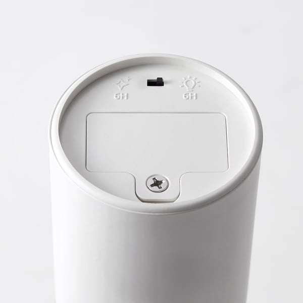 Top view of a modern white led lamp with flame effect settings and built-in timer.