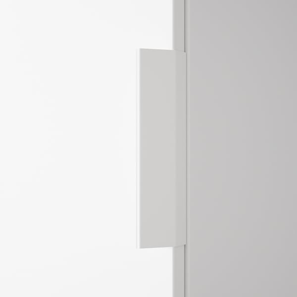 A minimalist white handle mounted on a smooth wall, showcasing modern design and quality material.