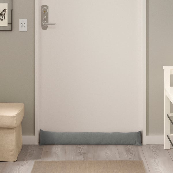 Gray recycled polyester and cotton LJUNGSNÄRJA door draft stopper, rectangular, fits under doors, smaller than other furniture items.