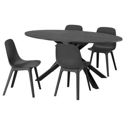 Black circular dining set with modern chairs, marble table, and sleek design