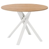 Modern round dining table with light wood top and white crossed metal legs. Elegant and sturdy design.