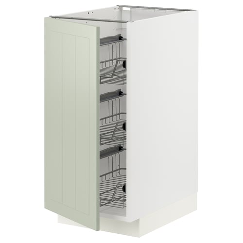 A METOD kitchen cabinet in green with organized interior shelves.