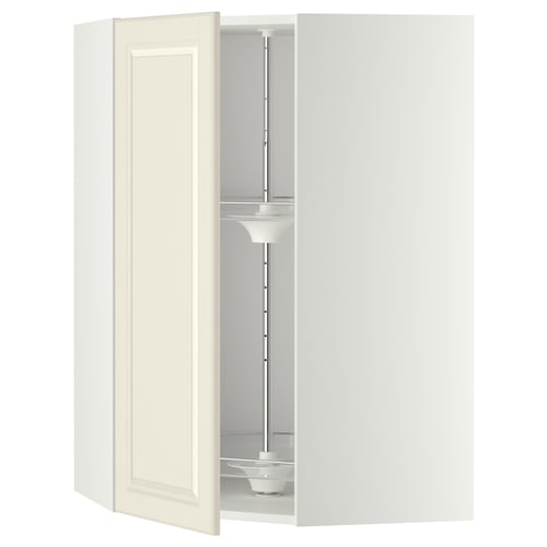 Depicts a white METOD kitchen cabinet with a swinging door in off-white and an internal carousel organiser.