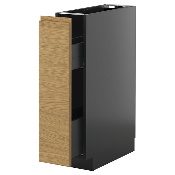 A black METOD kitchen cabinet with a wooden door pulled open, revealing shelves inside.