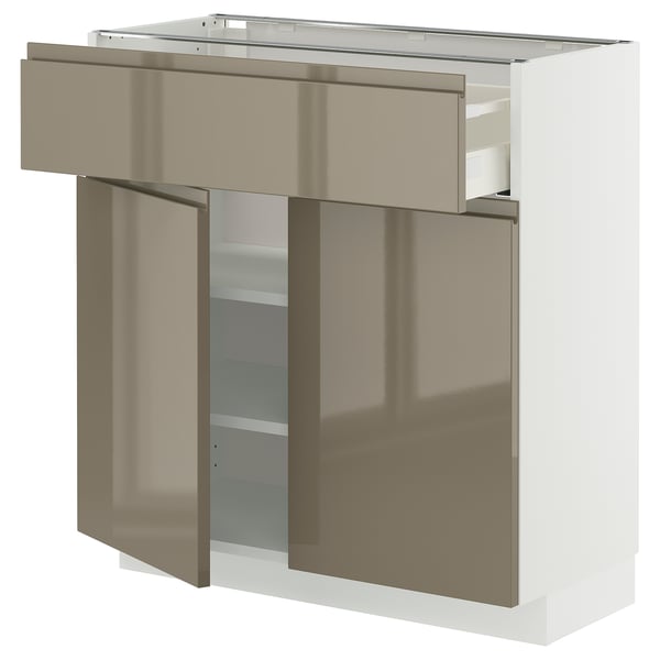 Modern kitchen cabinet in high gloss dark grey-brown with sleek, integrated handles, featuring a drawer and adjustable shelves.