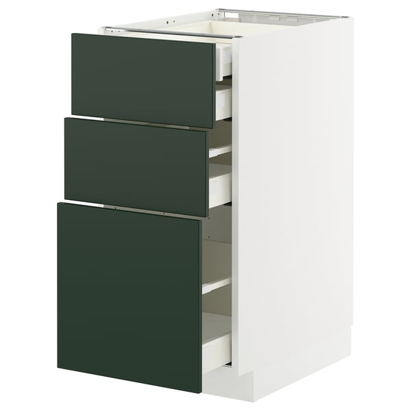 Modern kitchen cabinet with green drawers and white body, featuring sleek design and sturdy frame construction.