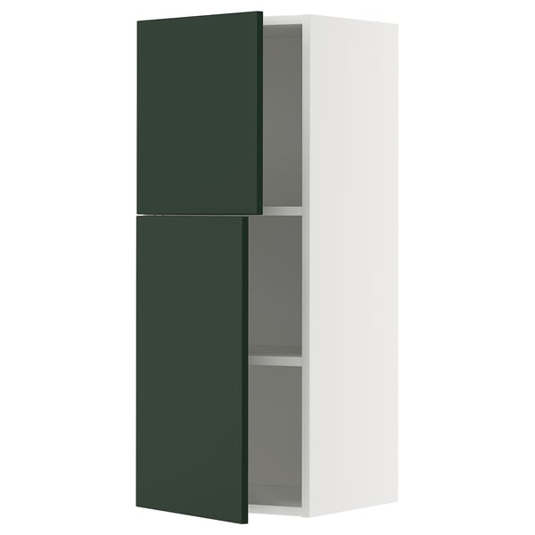 Image shows a white and green modern wall cabinet with adjustable shelves.