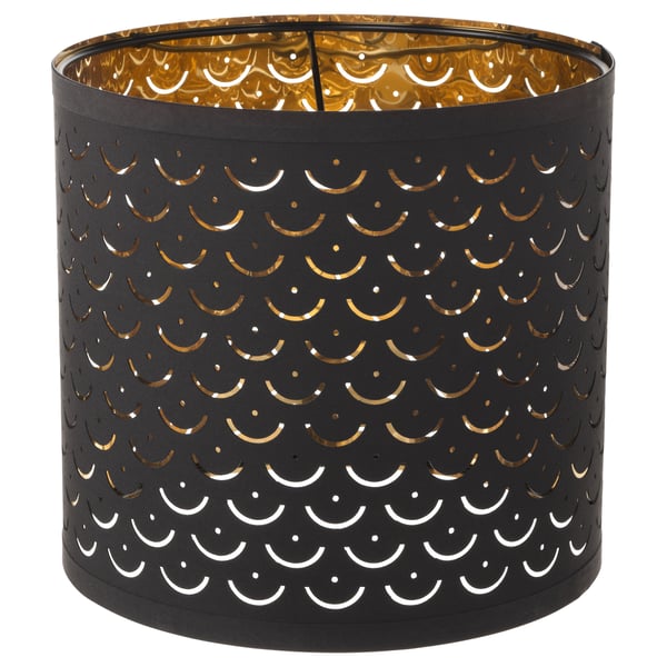 NYMÖ black lamp shade, circular with gold interior & moon cut-outs, creates decorative light patterns. Crafted from polyester, steel, & plastic.