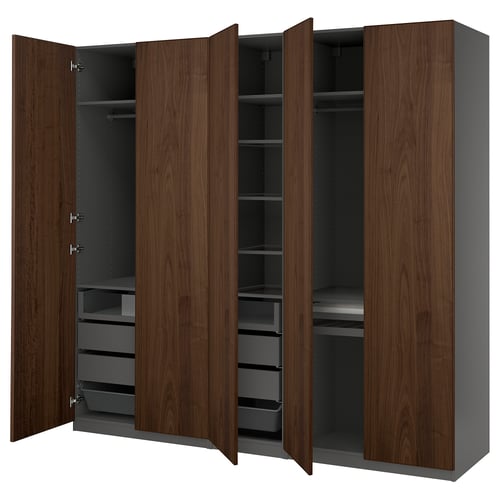 An open brown ikea PAX wardrobe with shelves and drawers.