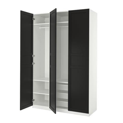 An open black and white ikea PAX wardrobe with shelves and a hanging rail. Its modern, rectangular, and has both drawers and hanging space.