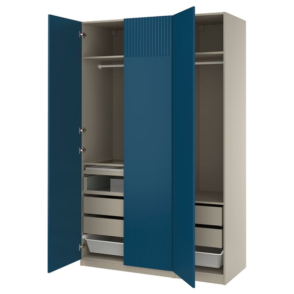 The open ikea PAX wardrobe with blue doors, featuring shelves and drawers inside.