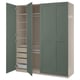 A green ikea PAX wardrobe with open doors, revealing shelves and storage inside.