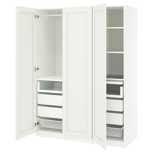 A white PAX wardrobe with open doors, featuring shelves and drawers.